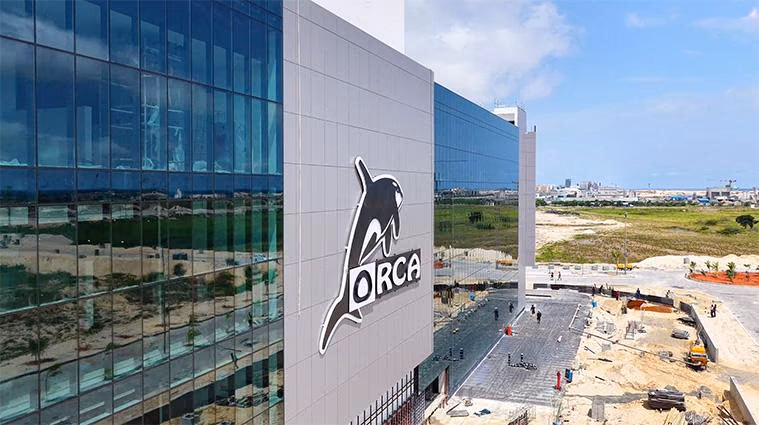 Shopping mall entrance with the ORCA sign beside a glazed facade