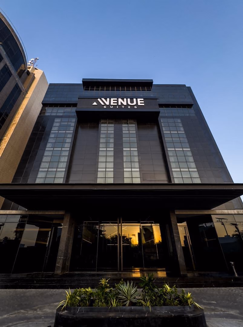 The Avenue Suites hotel entrance at dusk