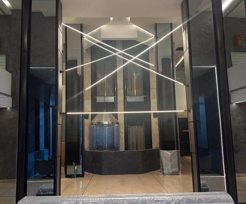 Lift lobby with linear light lines on the walls