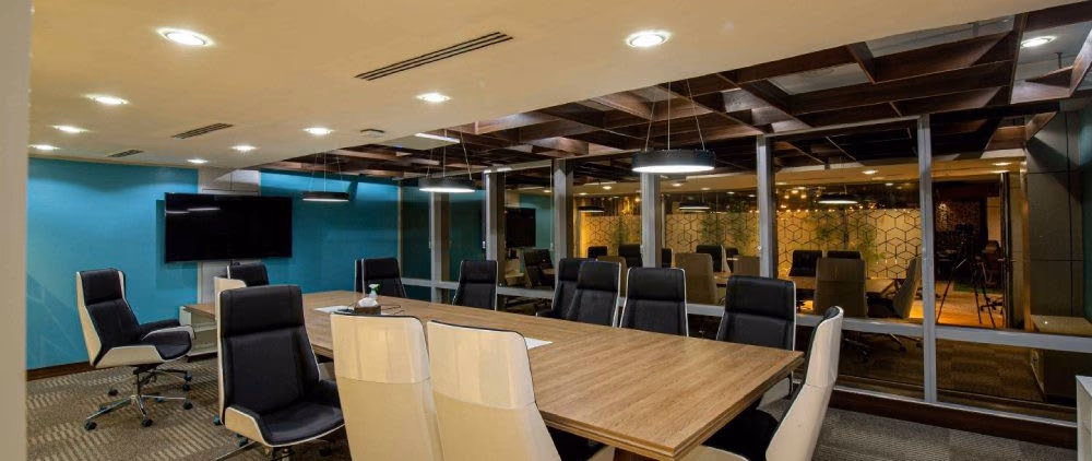 Boardroom with a long table and ceiling lighting